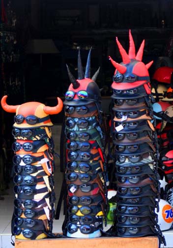 You know what a hit these motorcycle helmets from Bali would be back home,  but do you know what the safety regulations for their manufacture are? (Hint: the Indonesians don’t.)